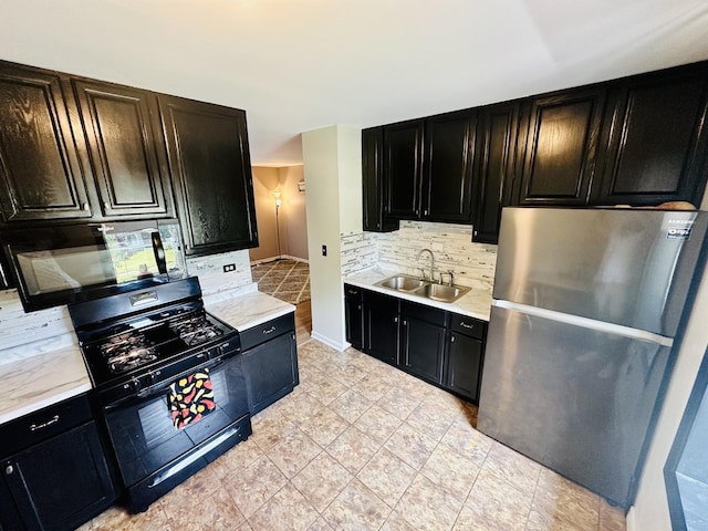 1015 Hastings Ln, Hanover Park, IL 60133 - kitchen featuring black appliances, dark cabinetry, backsplash, and light countertops