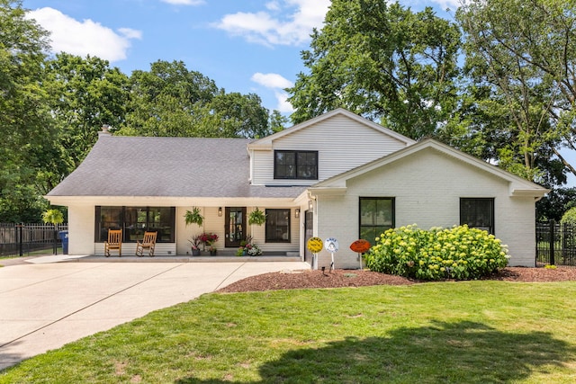 440 Menominee Ln, Naperville, IL 60563 - view of front of home with brick siding, a shingled roof, and driveway