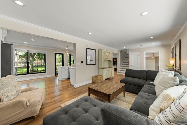 440 Menominee Ln, Naperville, IL 60563 - living room featuring stairs, recessed lighting, ornamental molding, and light wood-style floors
