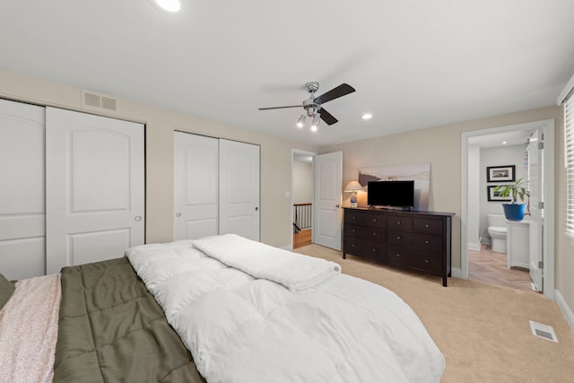 440 Menominee Ln, Naperville, IL 60563 - bedroom with two closets, recessed lighting, light carpet, ensuite bathroom, and ceiling fan