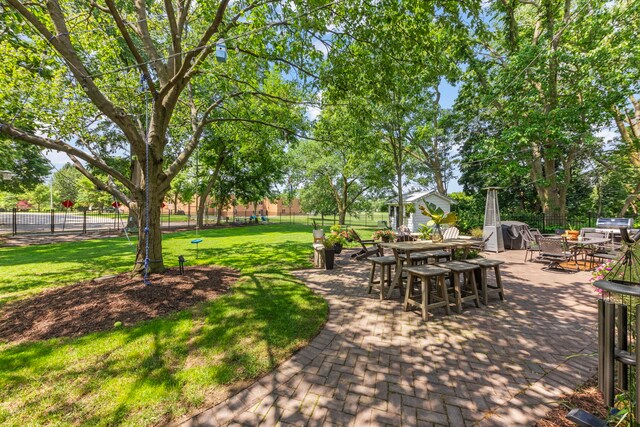 440 Menominee Ln, Naperville, IL 60563 - view of yard with outdoor dining space, a patio area, and an outdoor structure