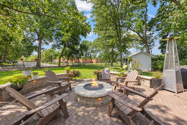 440 Menominee Ln, Naperville, IL 60563 - view of patio featuring a fire pit and an outbuilding