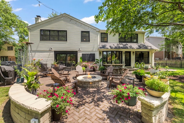 440 Menominee Ln, Naperville, IL 60563 - back of house with an outdoor fire pit, a patio, and a chimney
