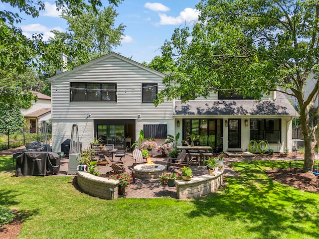 440 Menominee Ln, Naperville, IL 60563 - rear view of house featuring an outdoor fire pit, a patio, and brick siding