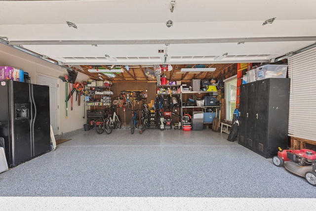 440 Menominee Ln, Naperville, IL 60563 - garage featuring black fridge and a workshop area