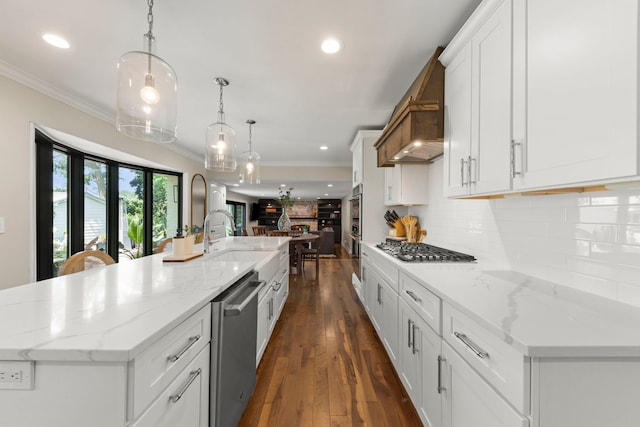 440 Menominee Ln, Naperville, IL 60563 - kitchen featuring stainless steel appliances, ornamental molding, open floor plan, white cabinetry, and a large island with sink