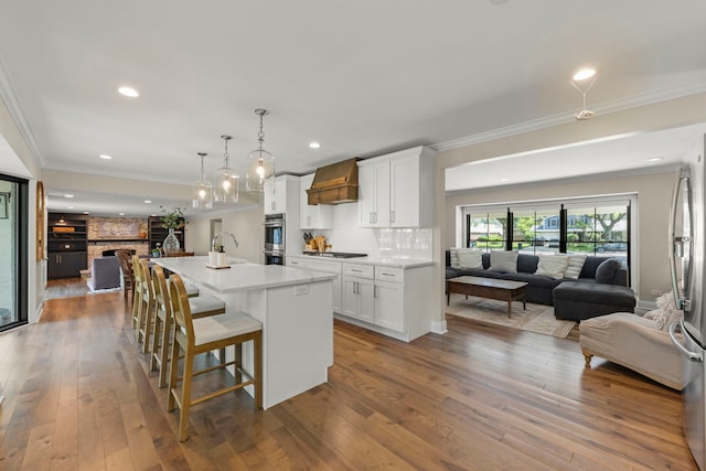 440 Menominee Ln, Naperville, IL 60563 - kitchen featuring open floor plan, stainless steel appliances, crown molding, decorative backsplash, and white cabinetry