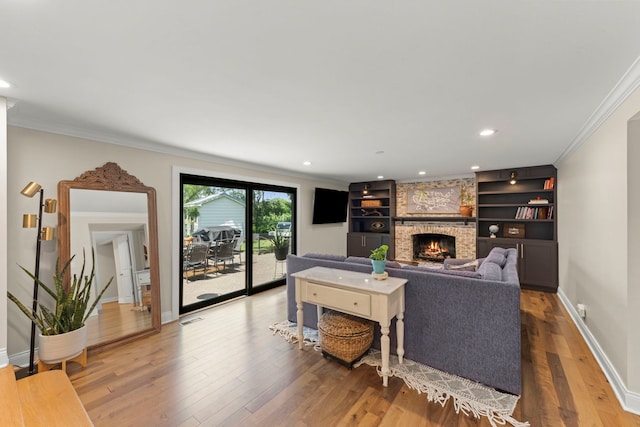 440 Menominee Ln, Naperville, IL 60563 - living area with a fireplace, wood finished floors, crown molding, and recessed lighting