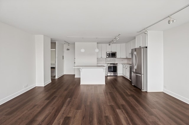 1460 N Sandburg Ter Unit 2703, Chicago, IL 60610 - kitchen featuring appliances with stainless steel finishes, track lighting, light countertops, tasteful backsplash, and white cabinets