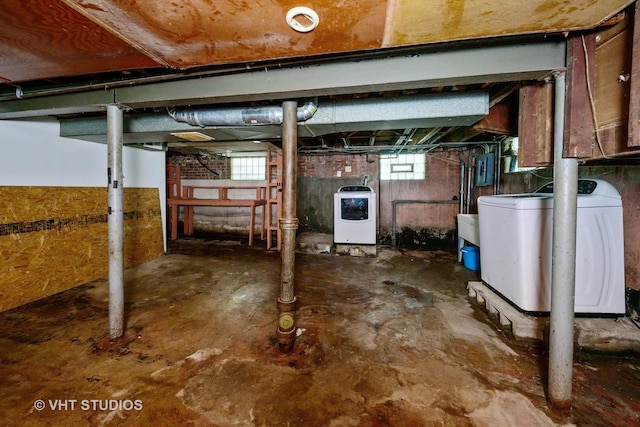 basement featuring washing machine and dryer