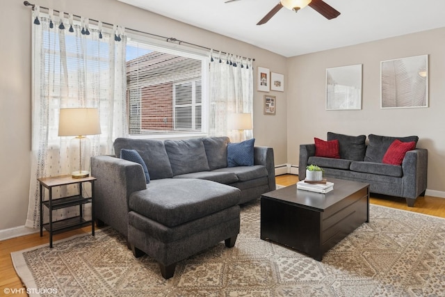 2652 W Rascher Ave Unit 304, Chicago, IL 60625 - living area with a baseboard heating unit, a ceiling fan, and wood finished floors