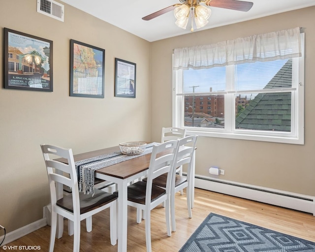 2652 W Rascher Ave Unit 304, Chicago, IL 60625 - dining space with ceiling fan, light wood-style flooring, and a baseboard radiator