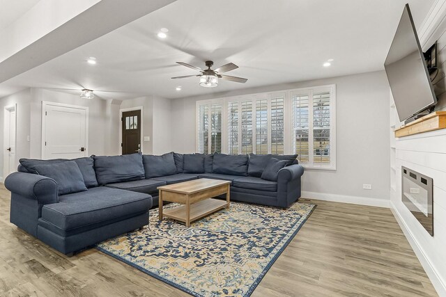 8081 Tennessee Ave, Willowbrook, IL 60527 - living room with recessed lighting, light wood finished floors, a ceiling fan, and a glass covered fireplace