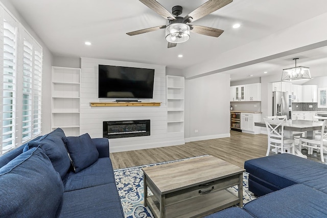 8081 Tennessee Ave, Willowbrook, IL 60527 - living room featuring light wood-style flooring, a ceiling fan, plenty of natural light, and recessed lighting
