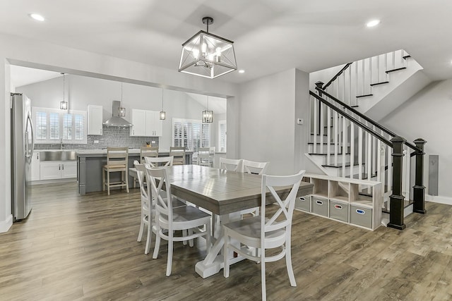 8081 Tennessee Ave, Willowbrook, IL 60527 - dining area featuring a chandelier, wood finished floors, recessed lighting, and stairs