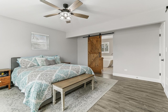 8081 Tennessee Ave, Willowbrook, IL 60527 - bedroom featuring a barn door, wood finished floors, multiple windows, and ceiling fan