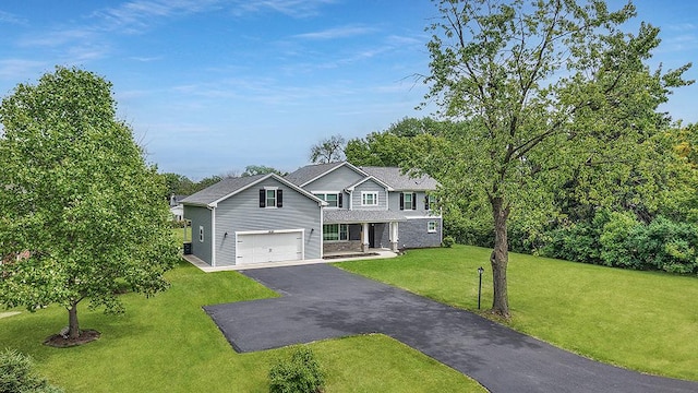 8081 Tennessee Ave, Willowbrook, IL 60527 - traditional-style home with driveway, a front yard, and a garage