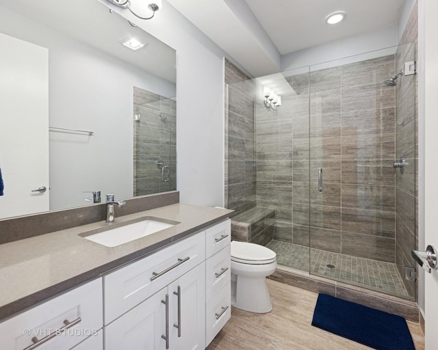 2442 N Clybourn Ave Unit 5S, Chicago, IL 60614 - full bath featuring vanity, a shower stall, wood finished floors, and recessed lighting