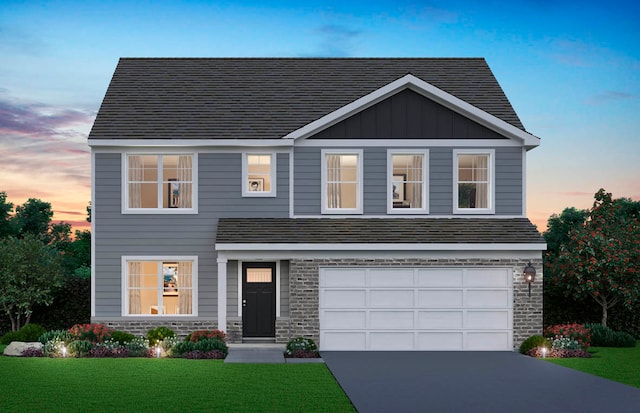 1818 Legacy Pointe Blvd, Plainfield, IL 60586 - view of front of property with driveway, a front lawn, an attached garage, and stone siding