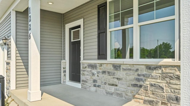 1818 Legacy Pointe Blvd, Plainfield, IL 60586 - doorway to property with covered porch and stone siding