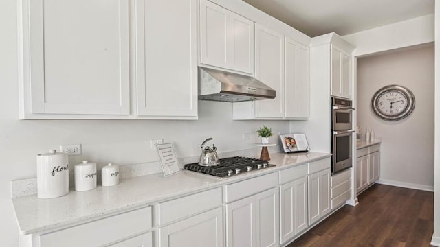 1818 Legacy Pointe Blvd, Plainfield, IL 60586 - kitchen featuring under cabinet range hood, appliances with stainless steel finishes, white cabinets, dark wood-style floors, and light stone countertops