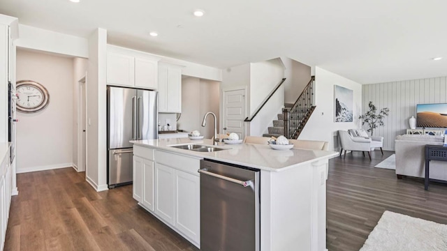 1818 Legacy Pointe Blvd, Plainfield, IL 60586 - kitchen with stainless steel appliances, open floor plan, white cabinetry, dark wood-style flooring, and light countertops
