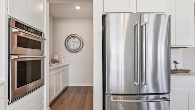 1818 Legacy Pointe Blvd, Plainfield, IL 60586 - kitchen with appliances with stainless steel finishes, dark wood-style flooring, white cabinetry, and recessed lighting