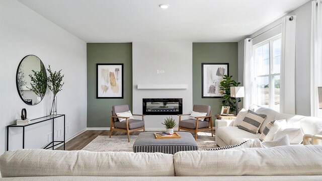 1818 Legacy Pointe Blvd, Plainfield, IL 60586 - living area with wood finished floors, a glass covered fireplace, and recessed lighting