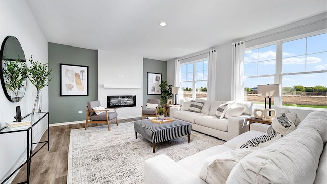 1818 Legacy Pointe Blvd, Plainfield, IL 60586 - living area with wood finished floors and a glass covered fireplace