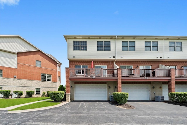 17946 Fountain Cir, Orland Park, IL 60467 - rear view of house featuring an attached garage, driveway, and brick siding