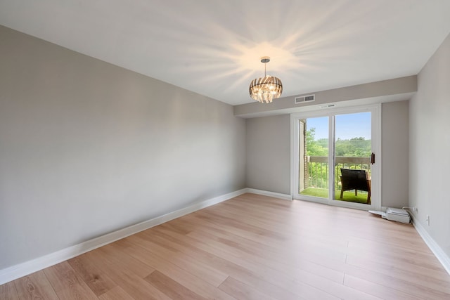 1250 Rudolph Rd Unit 4N, Northbrook, IL 60062 - empty room with light wood finished floors and a chandelier