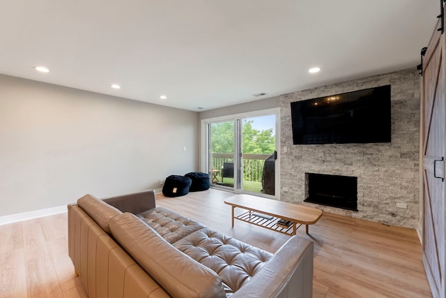 1250 Rudolph Rd Unit 4N, Northbrook, IL 60062 - living room with light wood-style floors, a fireplace, and recessed lighting