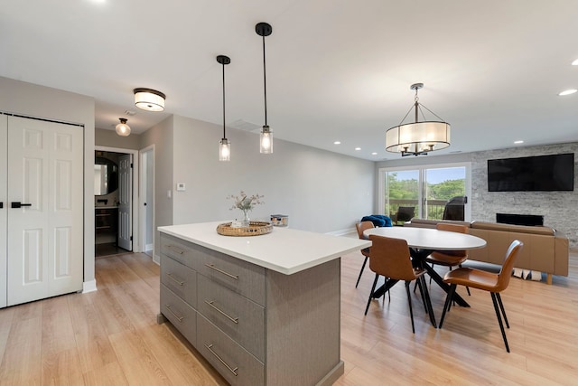 1250 Rudolph Rd Unit 4N, Northbrook, IL 60062 - kitchen featuring a kitchen island, light wood-type flooring, pendant lighting, and recessed lighting