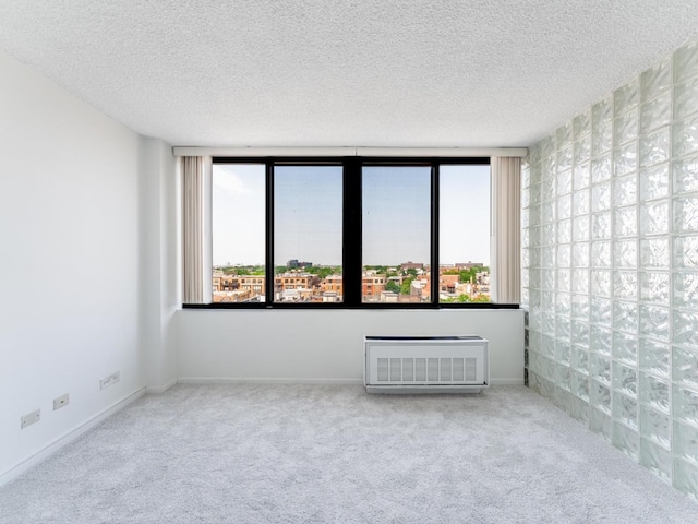 2754 N Hampden Ct Unit 1003, Chicago, IL 60614 - carpeted spare room featuring a wall mounted air conditioner and a textured ceiling