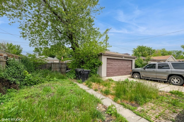 4322 W Walton St, Chicago, IL 60651 - view of yard with a detached garage and an outbuilding