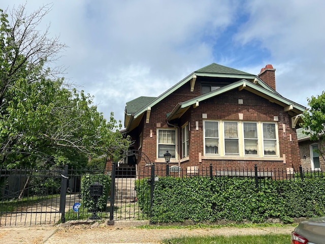 8144 S Ada St, Chicago, IL 60620 - view of side of home with brick siding, a chimney, a fenced front yard, and a gate
