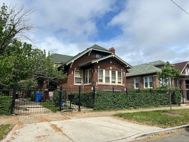8144 S Ada St, Chicago, IL 60620 - bungalow-style home featuring brick siding, a chimney, a fenced front yard, and roof with shingles