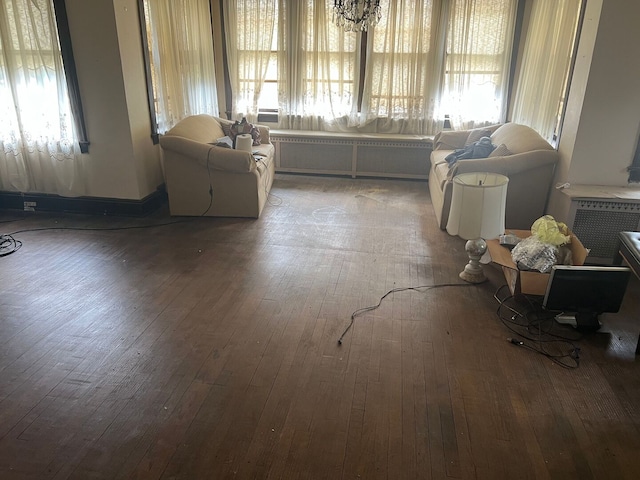 8144 S Ada St, Chicago, IL 60620 - living room featuring healthy amount of natural light, radiator heating unit, and wood-type flooring
