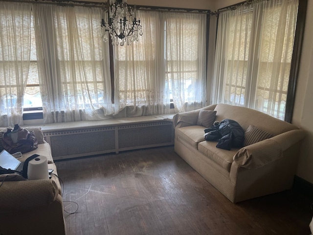8144 S Ada St, Chicago, IL 60620 - sitting room featuring a chandelier, radiator, and wood finished floors