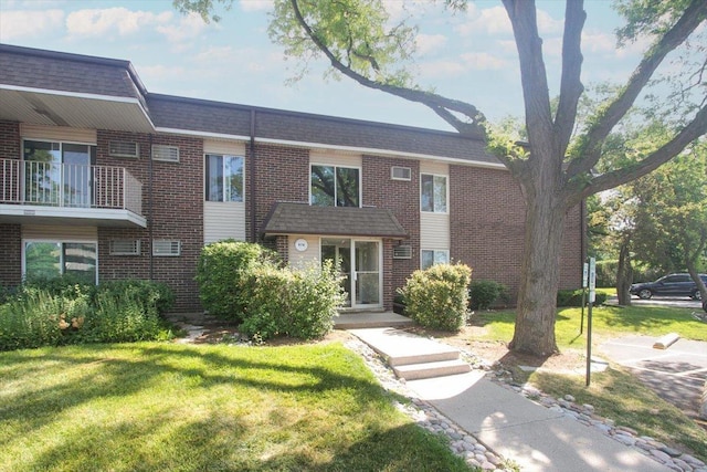 974 Thornton Ln Unit 107, Buffalo Grove, IL 60089 - view of property with brick siding and a front yard