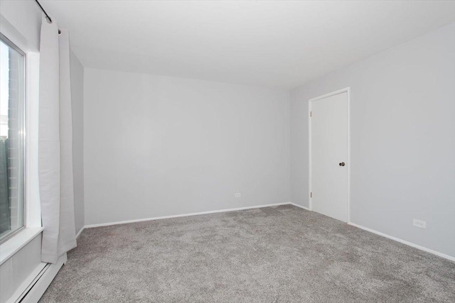 974 Thornton Ln Unit 107, Buffalo Grove, IL 60089 - carpeted spare room featuring a baseboard radiator and baseboards