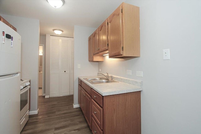 974 Thornton Ln Unit 107, Buffalo Grove, IL 60089 - kitchen with freestanding refrigerator, stainless steel range oven, light countertops, and dark wood-style flooring