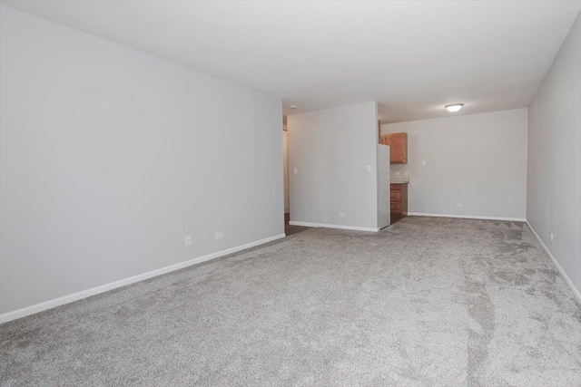 974 Thornton Ln Unit 107, Buffalo Grove, IL 60089 - empty room featuring light carpet and baseboards