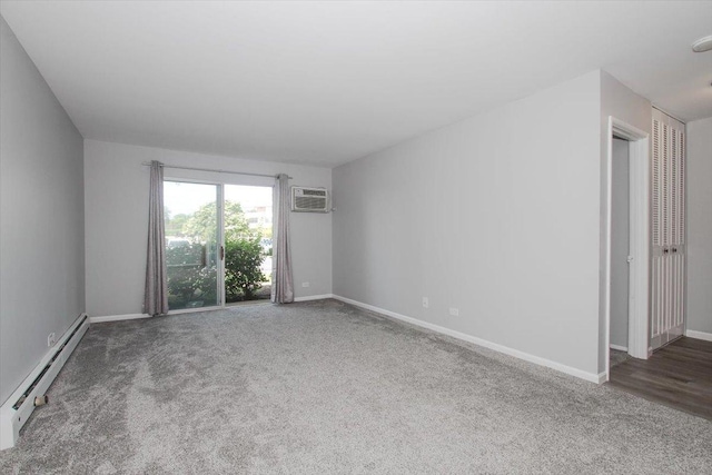 974 Thornton Ln Unit 107, Buffalo Grove, IL 60089 - carpeted empty room with a baseboard radiator, an AC wall unit, and a smoke detector