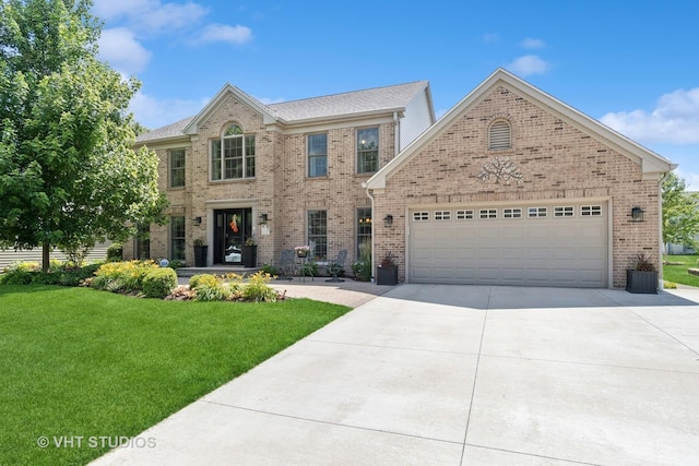 33 Citation Cir, Wheaton, IL 60189 - view of front facade with driveway, a front lawn, brick siding, and a garage