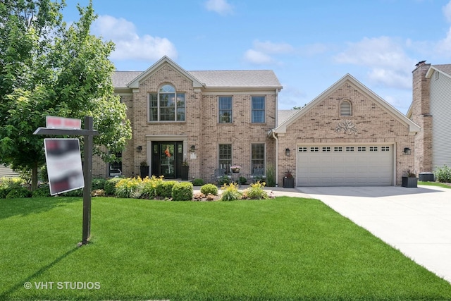 33 Citation Cir, Wheaton, IL 60189 - view of front of house with brick siding, an attached garage, concrete driveway, and a front yard
