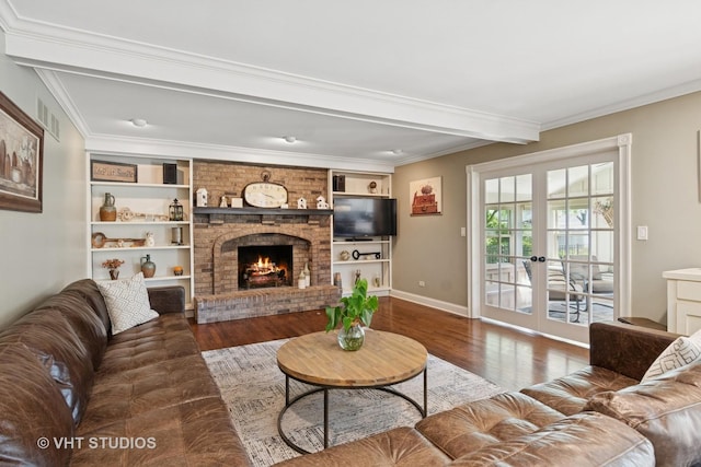 33 Citation Cir, Wheaton, IL 60189 - living area with wood finished floors, a brick fireplace, french doors, ornamental molding, and built in features