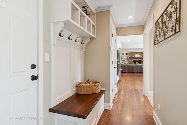 33 Citation Cir, Wheaton, IL 60189 - mudroom featuring light wood-style flooring, crown molding, recessed lighting, and a stone fireplace