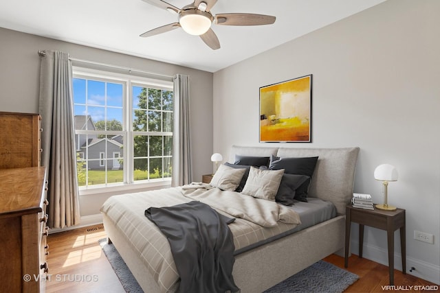 33 Citation Cir, Wheaton, IL 60189 - bedroom featuring light wood-type flooring and a ceiling fan
