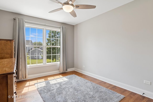 33 Citation Cir, Wheaton, IL 60189 - empty room with ceiling fan and wood finished floors